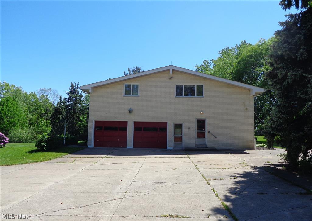 8819 Diagonal Road Streetsboro, OH 44241 - Photo 2 of 23 Huge parking pad by the 2 car garage. Enter into the 'mud'room/laundry room, or the garage man door from this side.