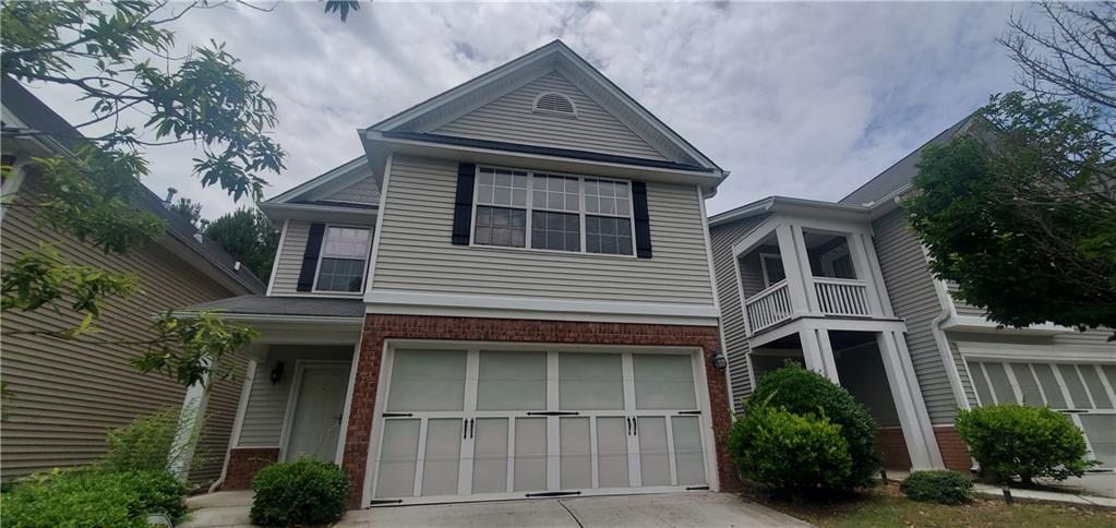 6251 Lake Valley Point Lithonia, GA 30058 - Photo 1 of 1 a front view of a house with a yard