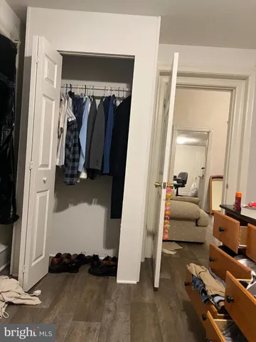 a view of living room and wooden floor