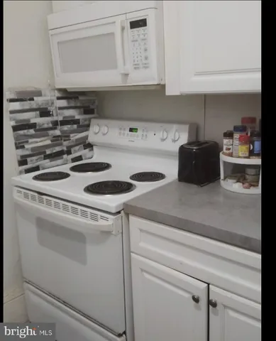 a close view of stove and microwave