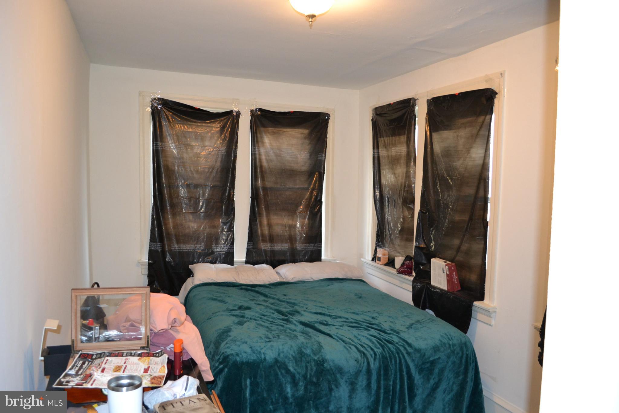 29 South Main Street Glassboro, NJ 08028 - Photo 31 of 38 Cozy bedroom with darkened windows.