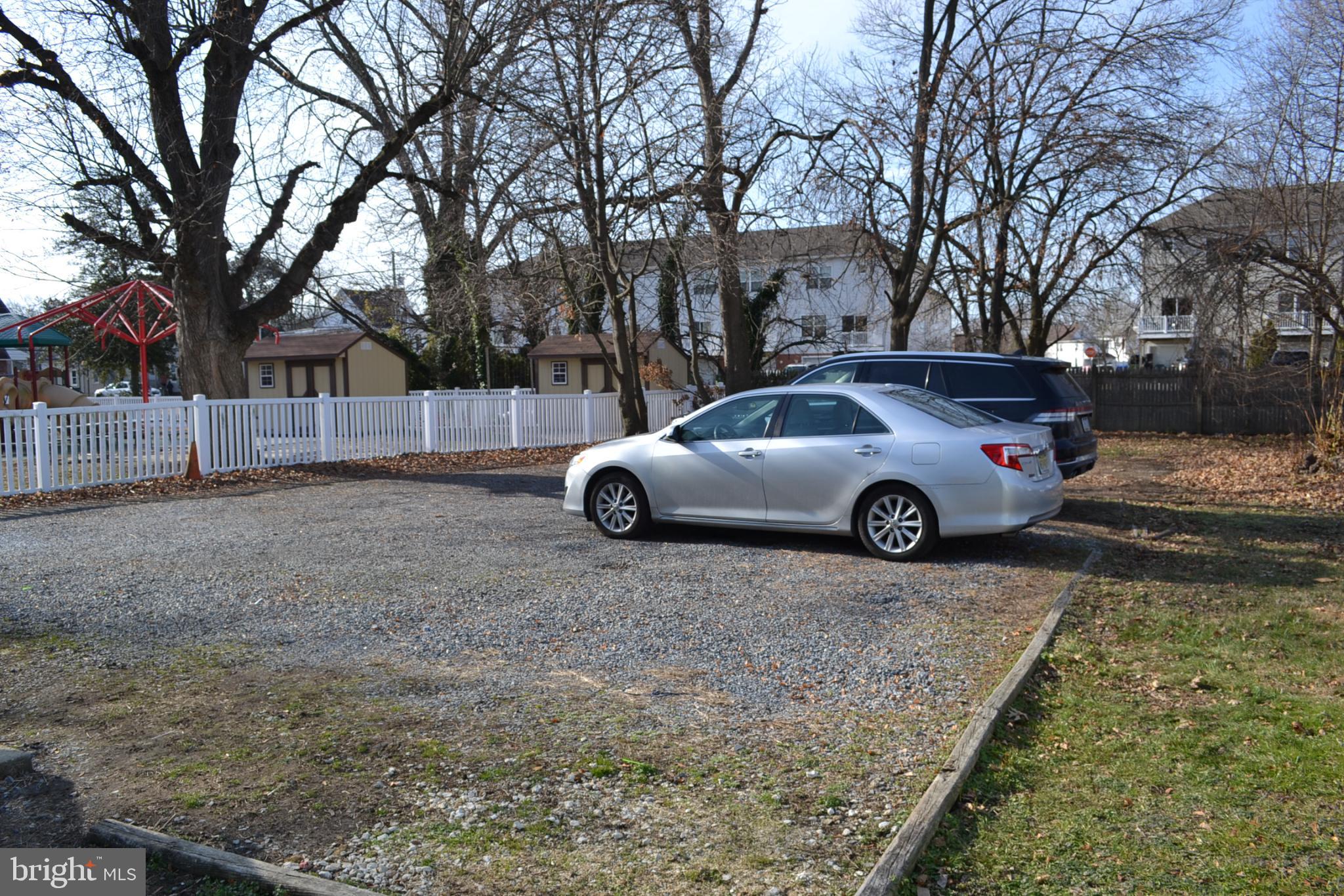 29 South Main Street Glassboro, NJ 08028 - Photo 33 of 38 Spacious gravel parking area in serene setting.