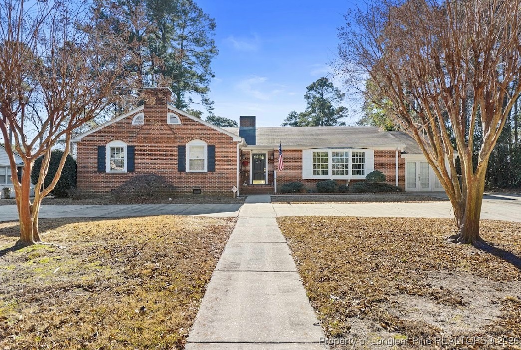 1717 Raeford Road Fayetteville, NC 28305 - Photo 1 of 25 a front view of a house with a yard