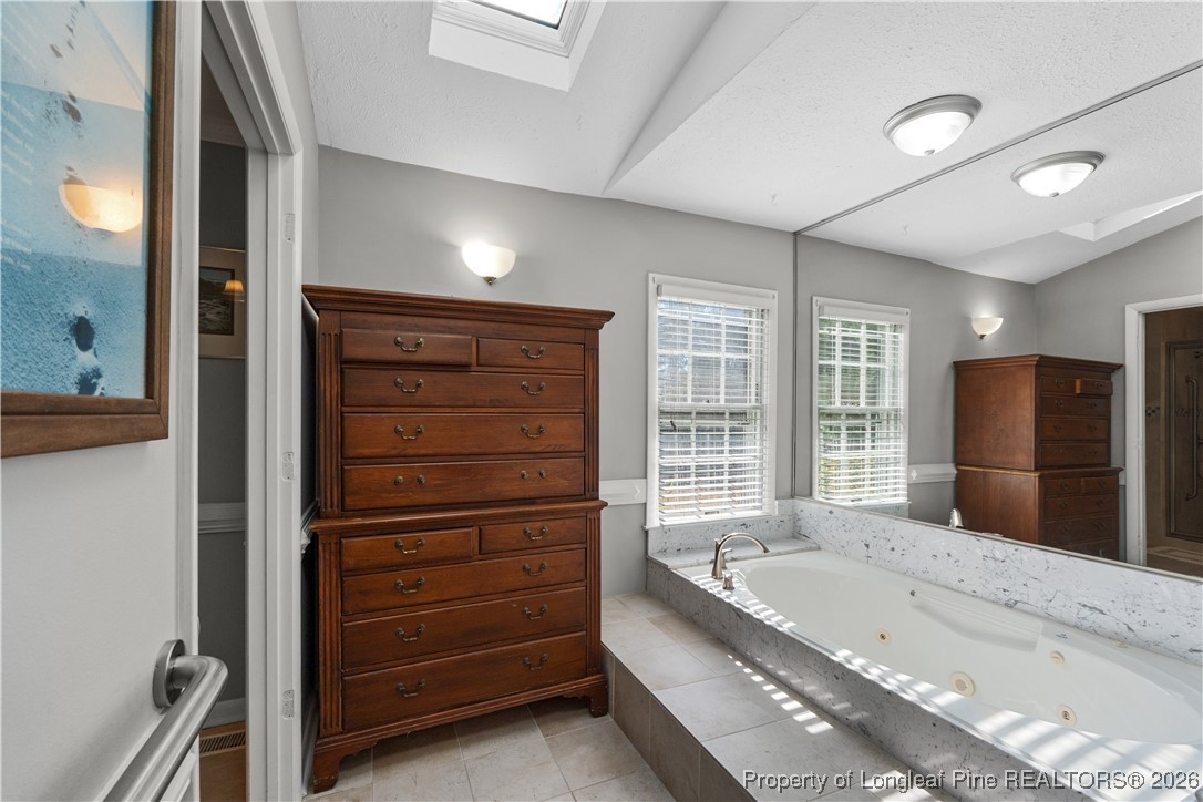 1717 Raeford Road Fayetteville, NC 28305 - Photo 11 of 25 a large spacious bathroom with a large tub and shower