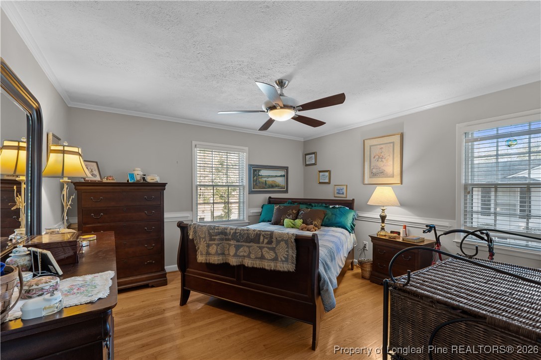 1717 Raeford Road Fayetteville, NC 28305 - Photo 13 of 25 a bedroom with furniture and a window