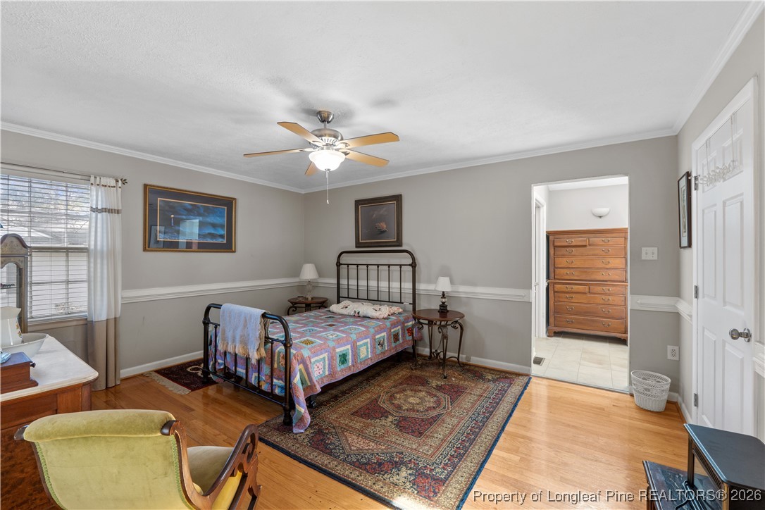 1717 Raeford Road Fayetteville, NC 28305 - Photo 16 of 25 a bedroom with furniture and a window