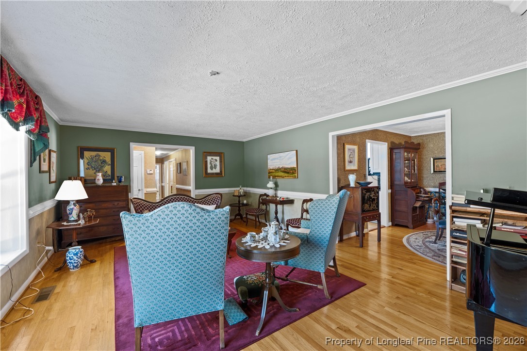 1717 Raeford Road Fayetteville, NC 28305 - Photo 19 of 25 a living room with furniture and wooden floor