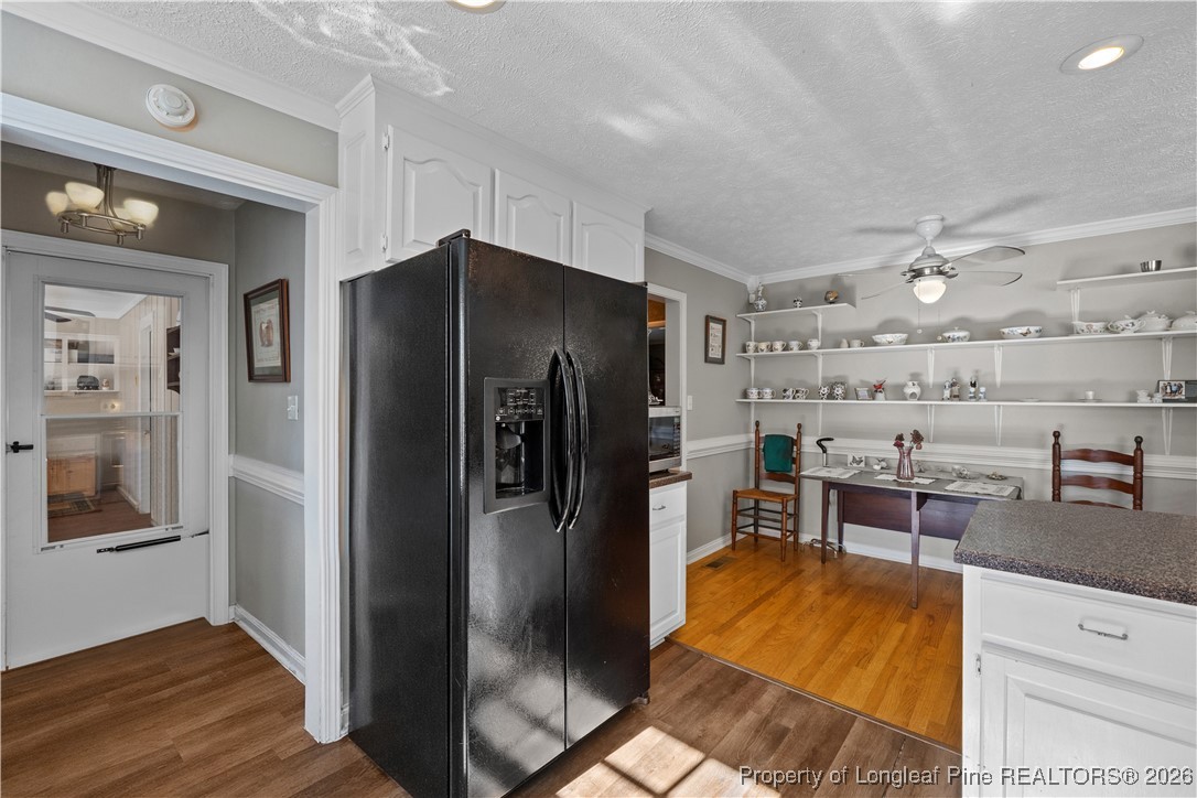 1717 Raeford Road Fayetteville, NC 28305 - Photo 7 of 25 a kitchen with stainless steel appliances kitchen island a refrigerator and a stove