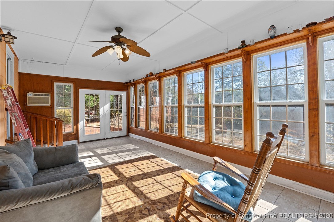 1717 Raeford Road Fayetteville, NC 28305 - Photo 8 of 25 a living room with furniture and a floor to ceiling window