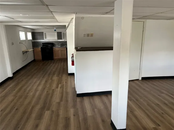 a view of a refrigerator in kitchen and wooden floor