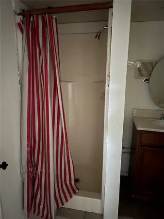a view of a hallway with a chair