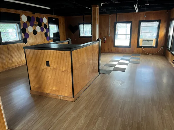 a view of a living room and hardwood floor