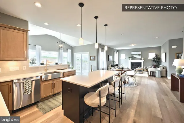 a large kitchen with a table and chairs
