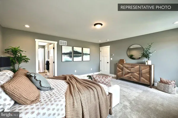 a bedroom with bed and window