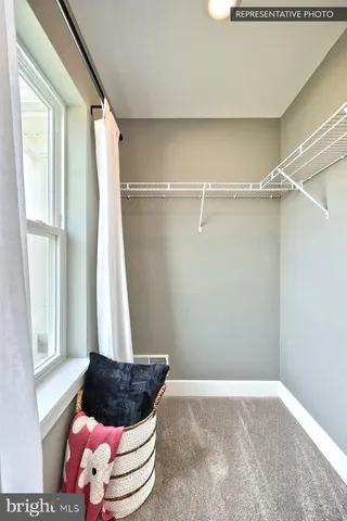 a room with a bed and a window