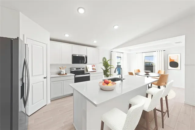a kitchen with a sink a stove and refrigerator