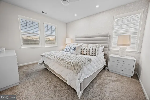 a bathroom with a toilet a sink and a mirror