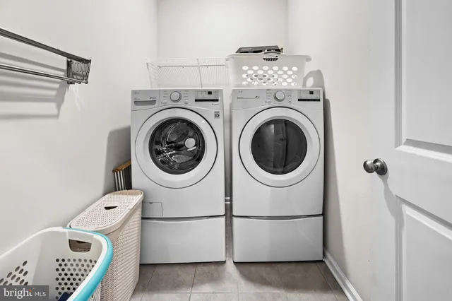 a bathroom with a sink a toilet a mirror a bathtub and shower
