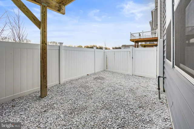 a living room with furniture gym equipment and a flat screen tv