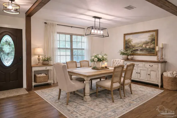 a kitchen with stainless steel appliances a refrigerator a sink a stove a microwave and island