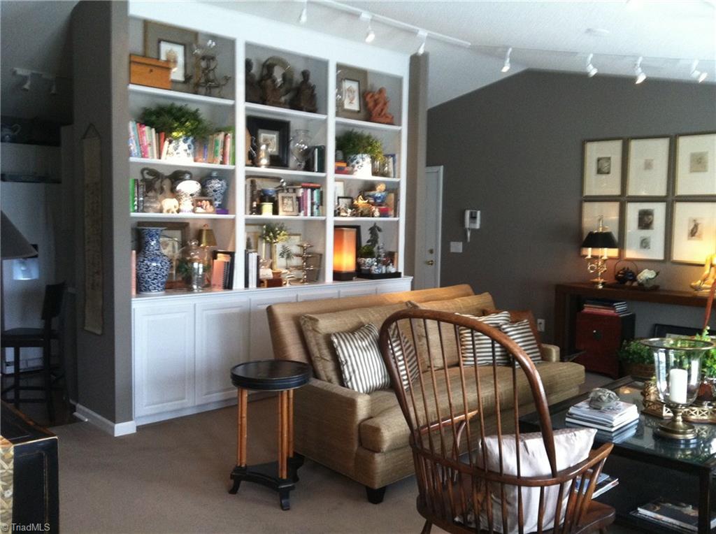 135 James High Point, Unit 3A High Point, NC 27265 - Photo 3 of 15 Living Room: This grand built in bookcase adds sophistication as well as storage.