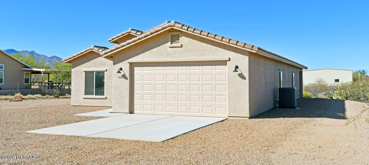 1091 North Vail View Road Vail, AZ 85641 - Photo 42 of 43 a front view of a house with a yard