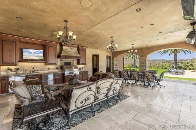 a living room with lots of furniture and white walls