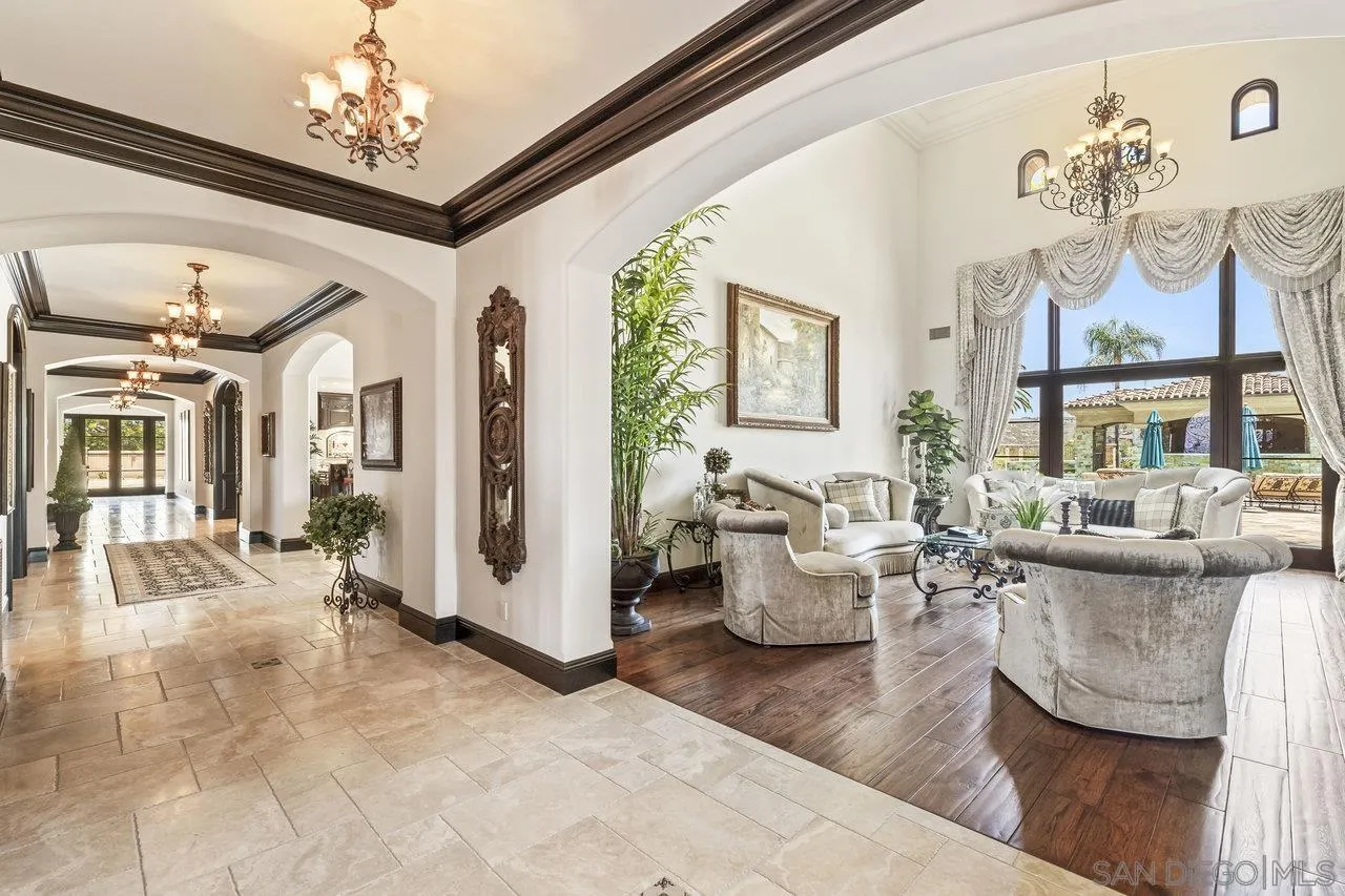 14170 Bryce Point Poway, CA 92064 - Photo 22 of 67 a living room with fireplace furniture and a chandelier
