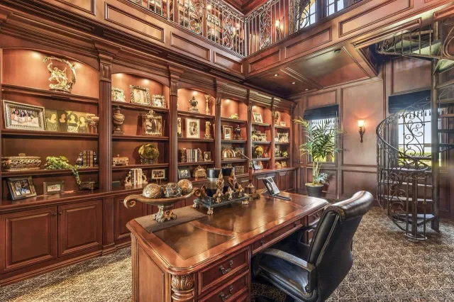 a kitchen with kitchen island granite countertop a sink and a stove