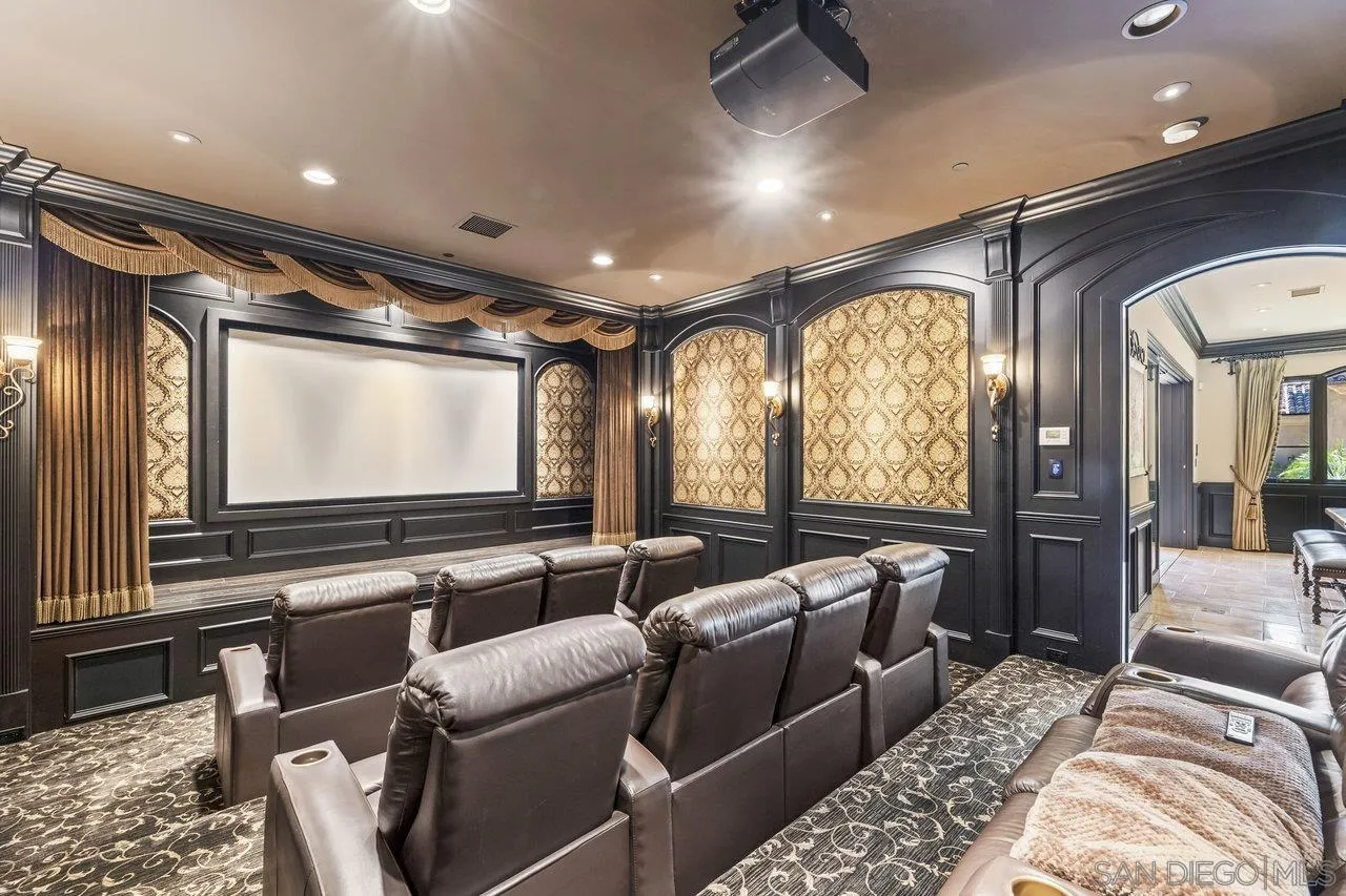 14170 Bryce Point Poway, CA 92064 - Photo 25 of 67 a media room with lots of chairs and a projector screen