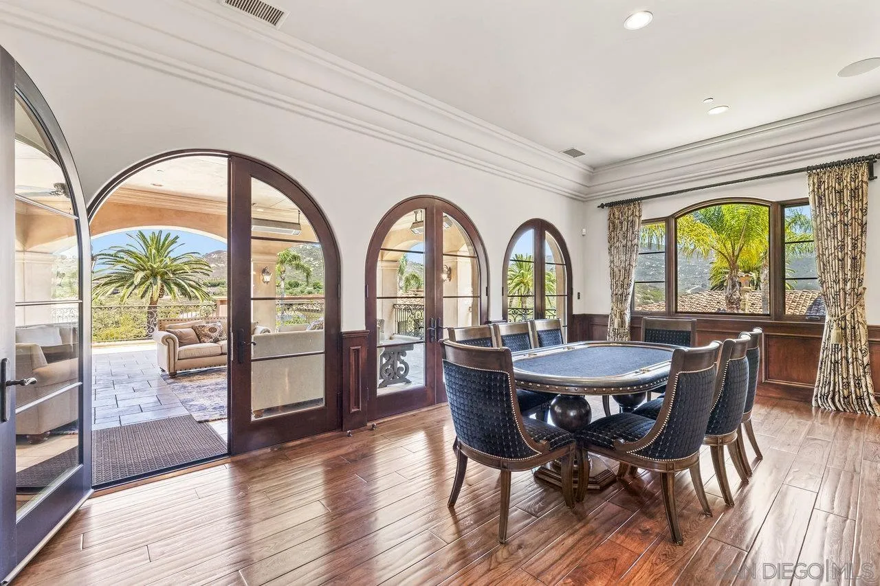 14170 Bryce Point Poway, CA 92064 - Photo 49 of 67 a view of a dining room with furniture a chandelier and wooden floor