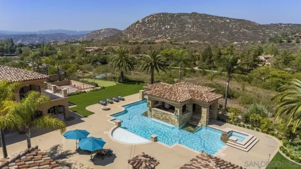 an aerial view of a house with a garden