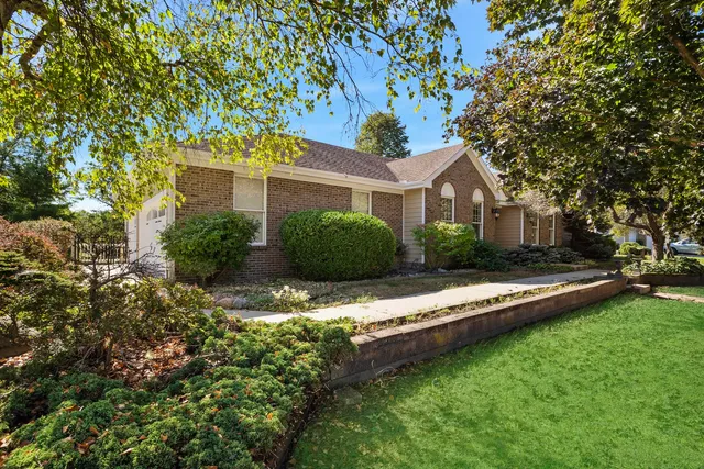 a view of a house with a yard porch and sitting area
