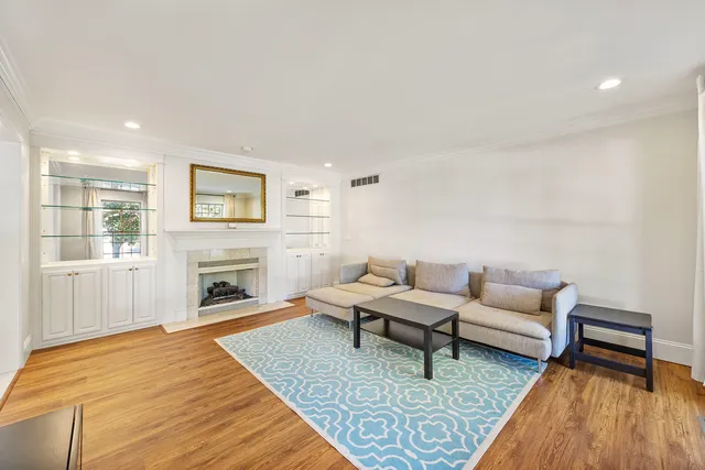 a white toilet sitting next to a bathroom sink