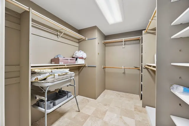 a view of a kitchen with a sink and cabinets