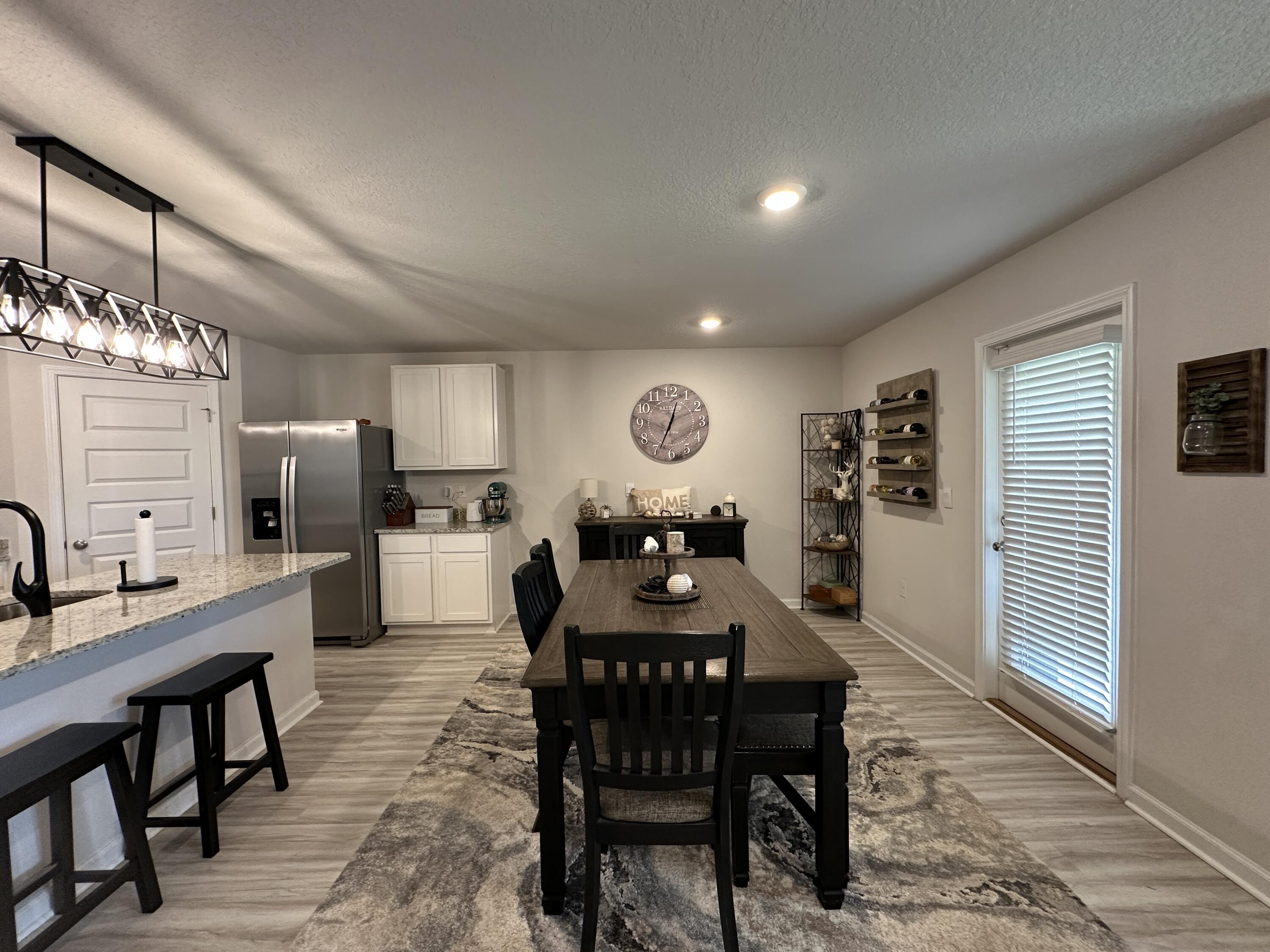 828 Otto Loop Crestview, FL 32539 - Photo 11 of 30 a view of a dining room with furniture