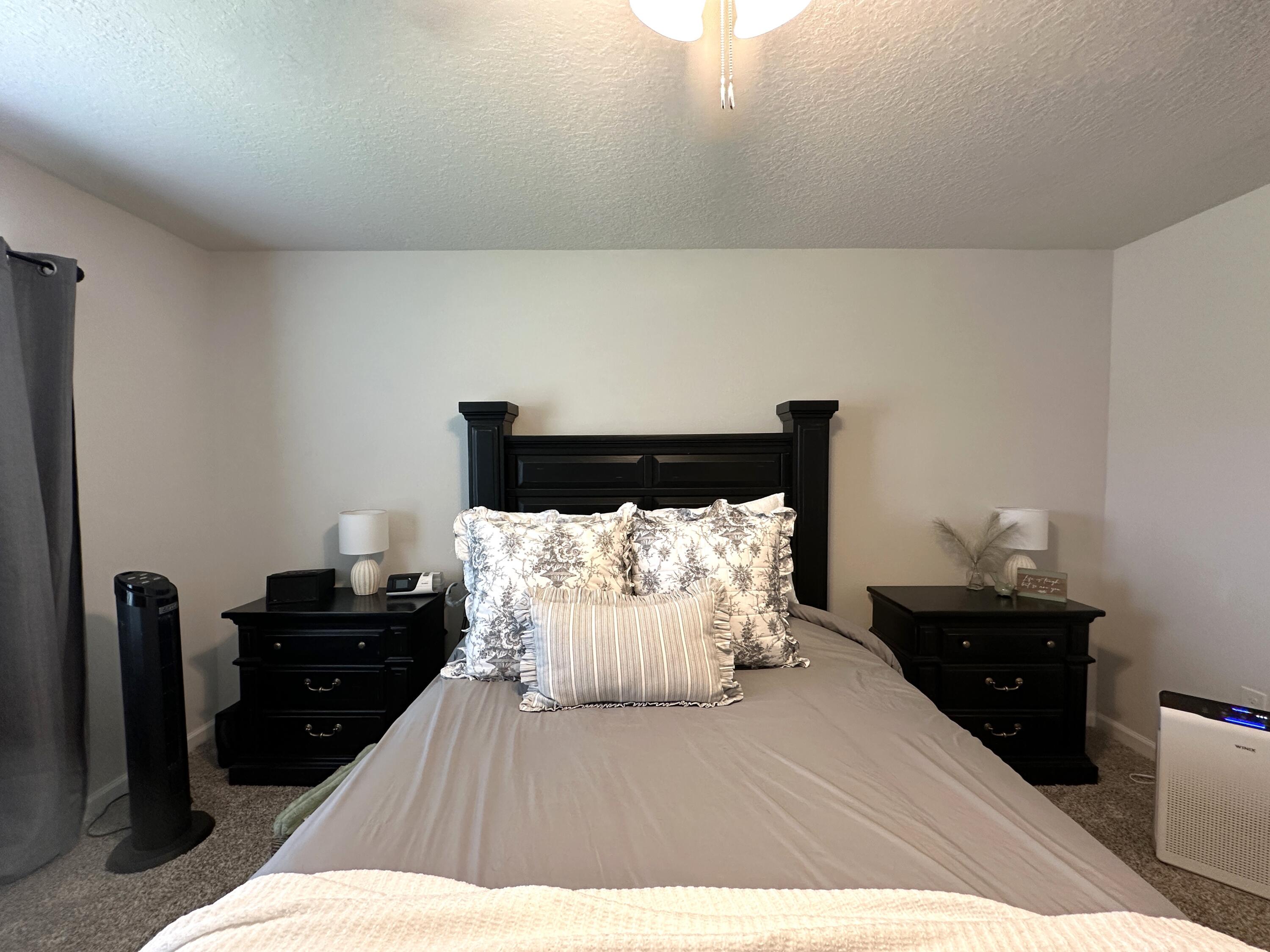 828 Otto Loop Crestview, FL 32539 - Photo 14 of 30 a bedroom with a bed and a night stand
