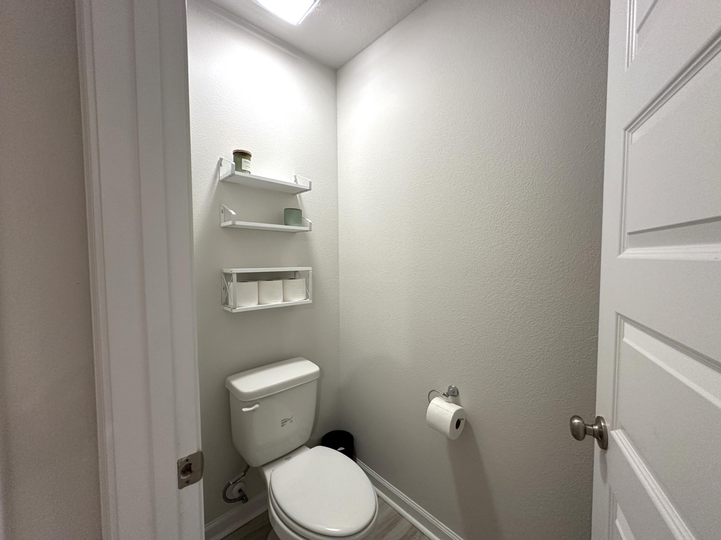 828 Otto Loop Crestview, FL 32539 - Photo 18 of 30 a bathroom with a toilet