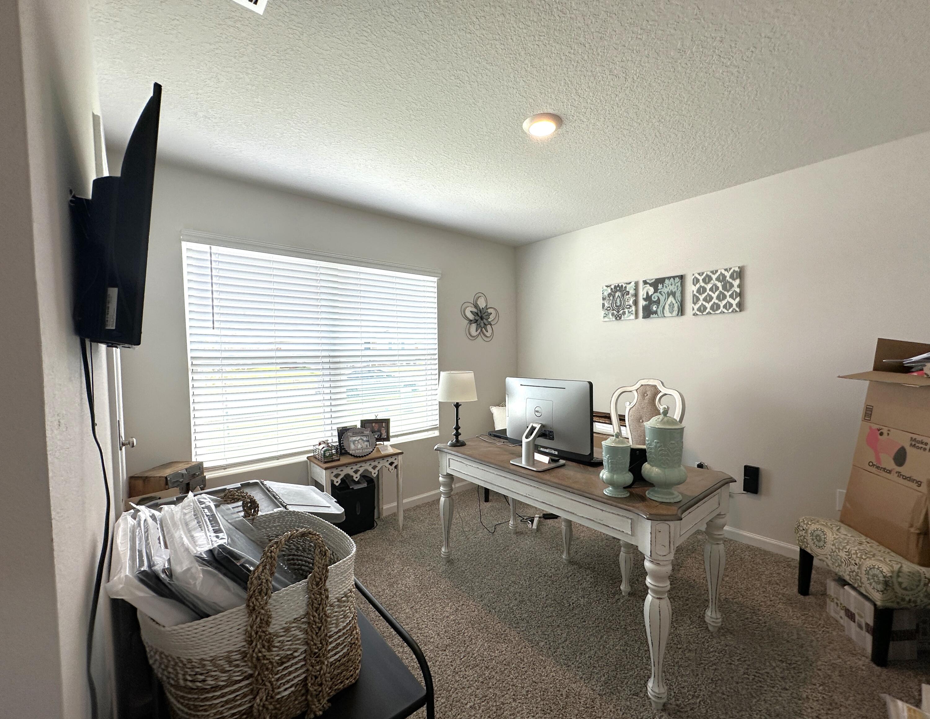 828 Otto Loop Crestview, FL 32539 - Photo 19 of 30 a living room with furniture and a flat screen tv