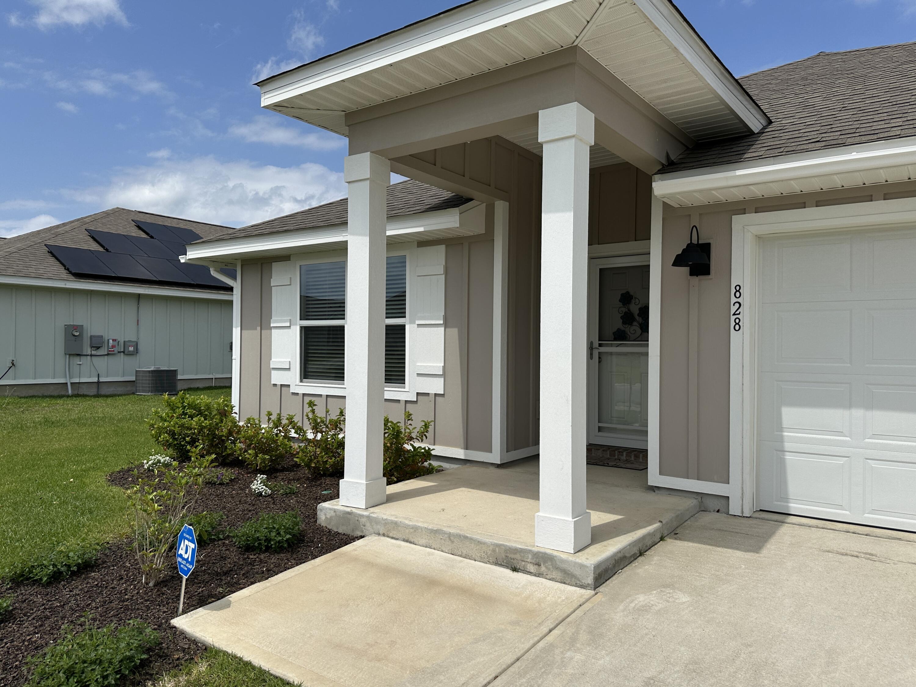 828 Otto Loop Crestview, FL 32539 - Photo 25 of 30 a view of a entryway door front of house
