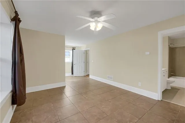 wooden floor in an empty room with a mirror