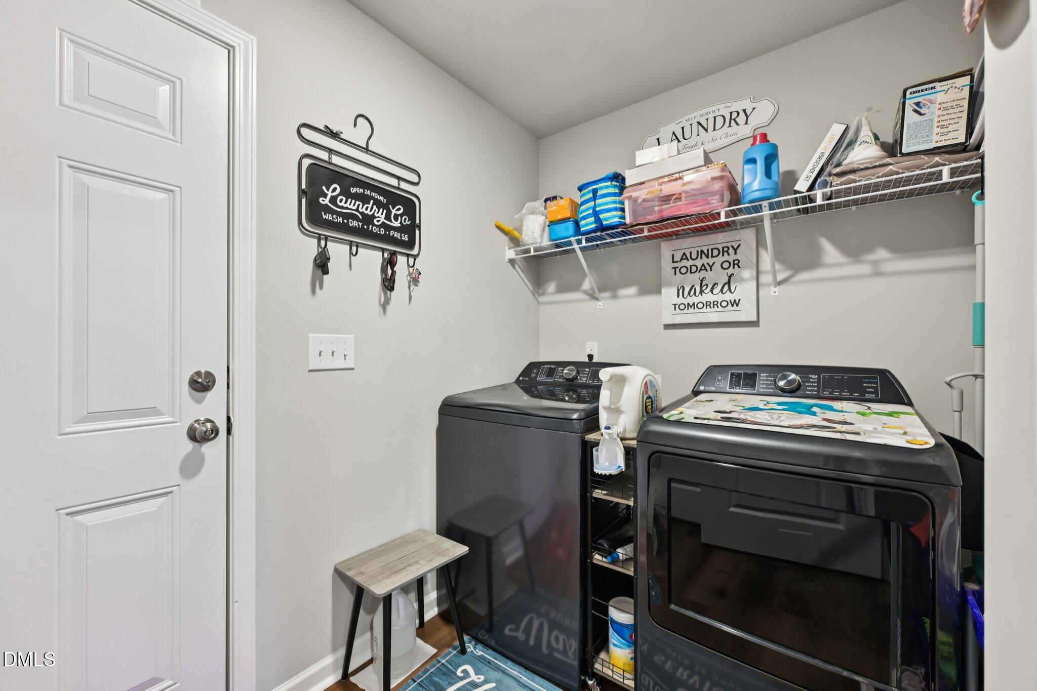 391 Byrdtown Road Benson, NC 27504 - Photo 11 of 28 a utility room with dryer and washer