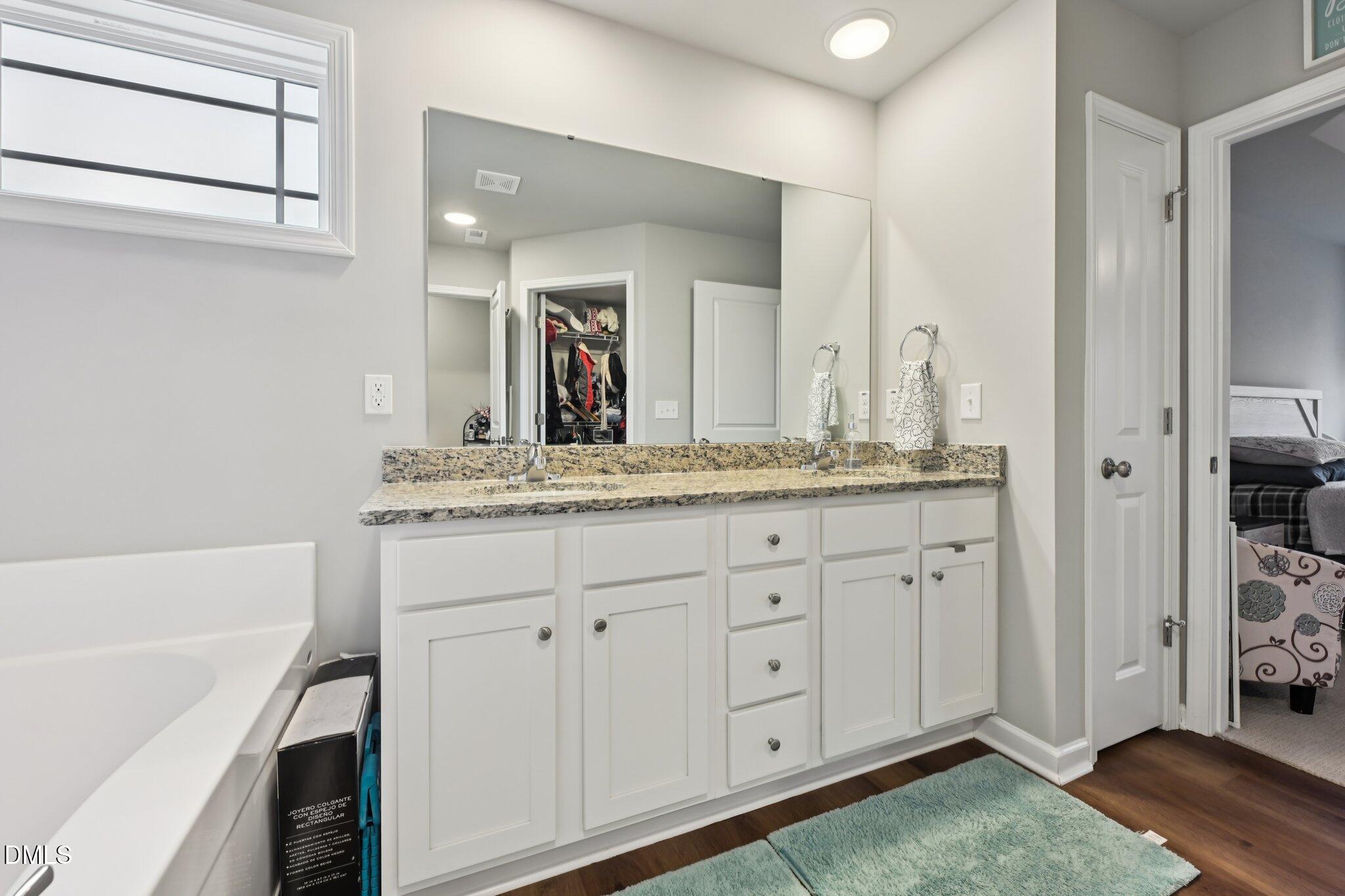391 Byrdtown Road Benson, NC 27504 - Photo 15 of 28 a bathroom with a sink and a mirror