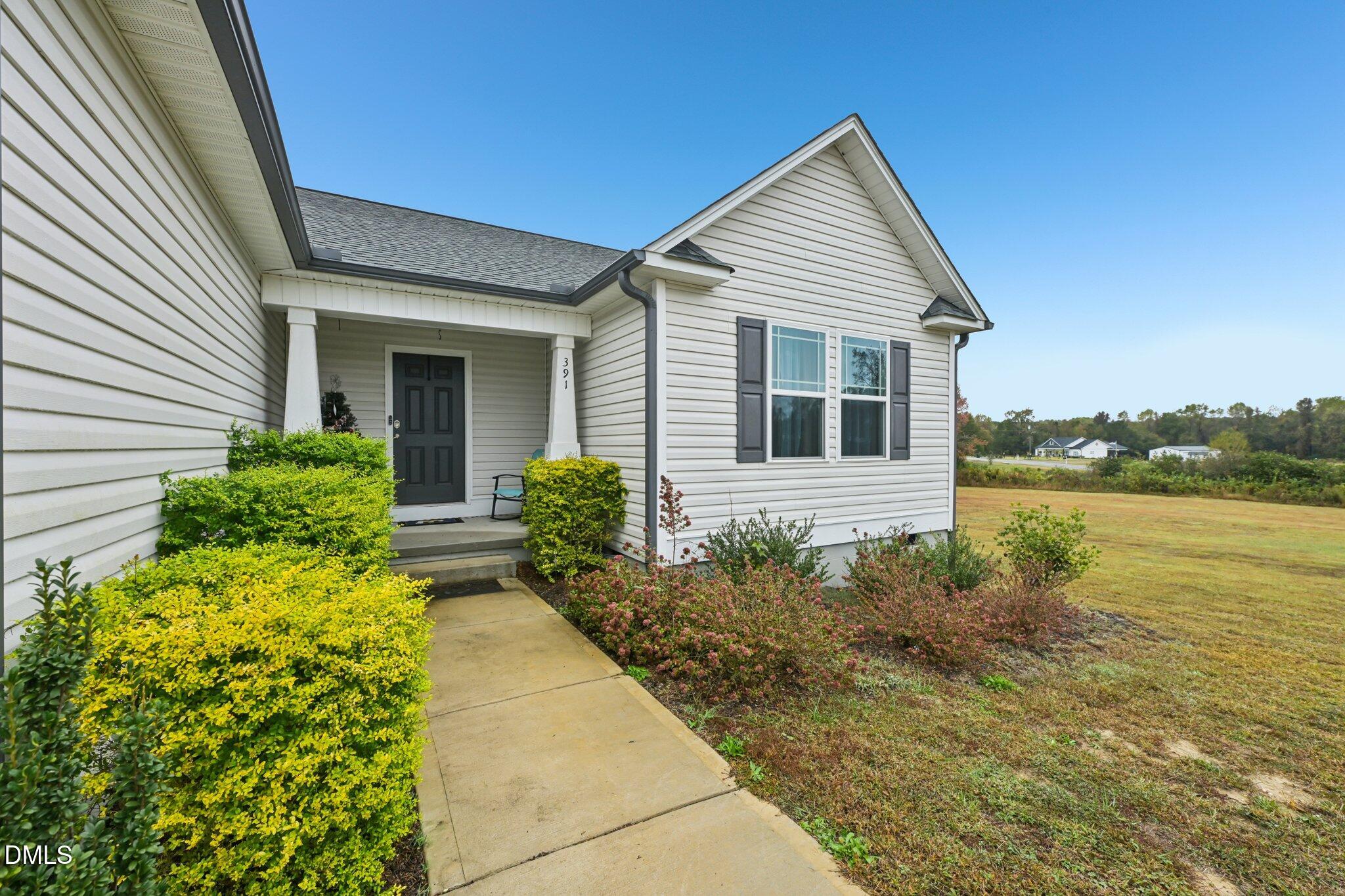 391 Byrdtown Road Benson, NC 27504 - Photo 2 of 28 a house with garden in front of it