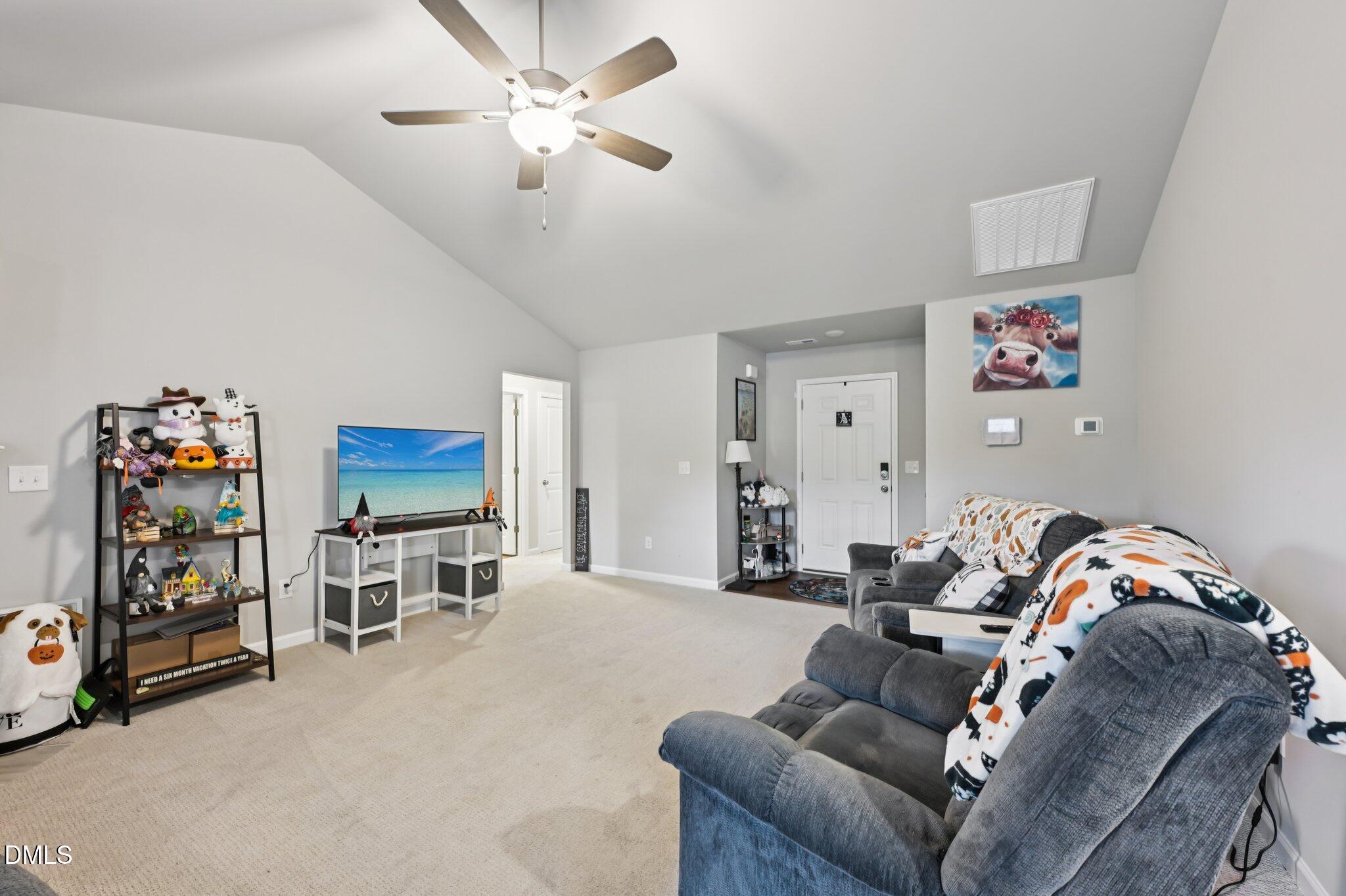391 Byrdtown Road Benson, NC 27504 - Photo 5 of 28 a living room with furniture and a flat screen tv