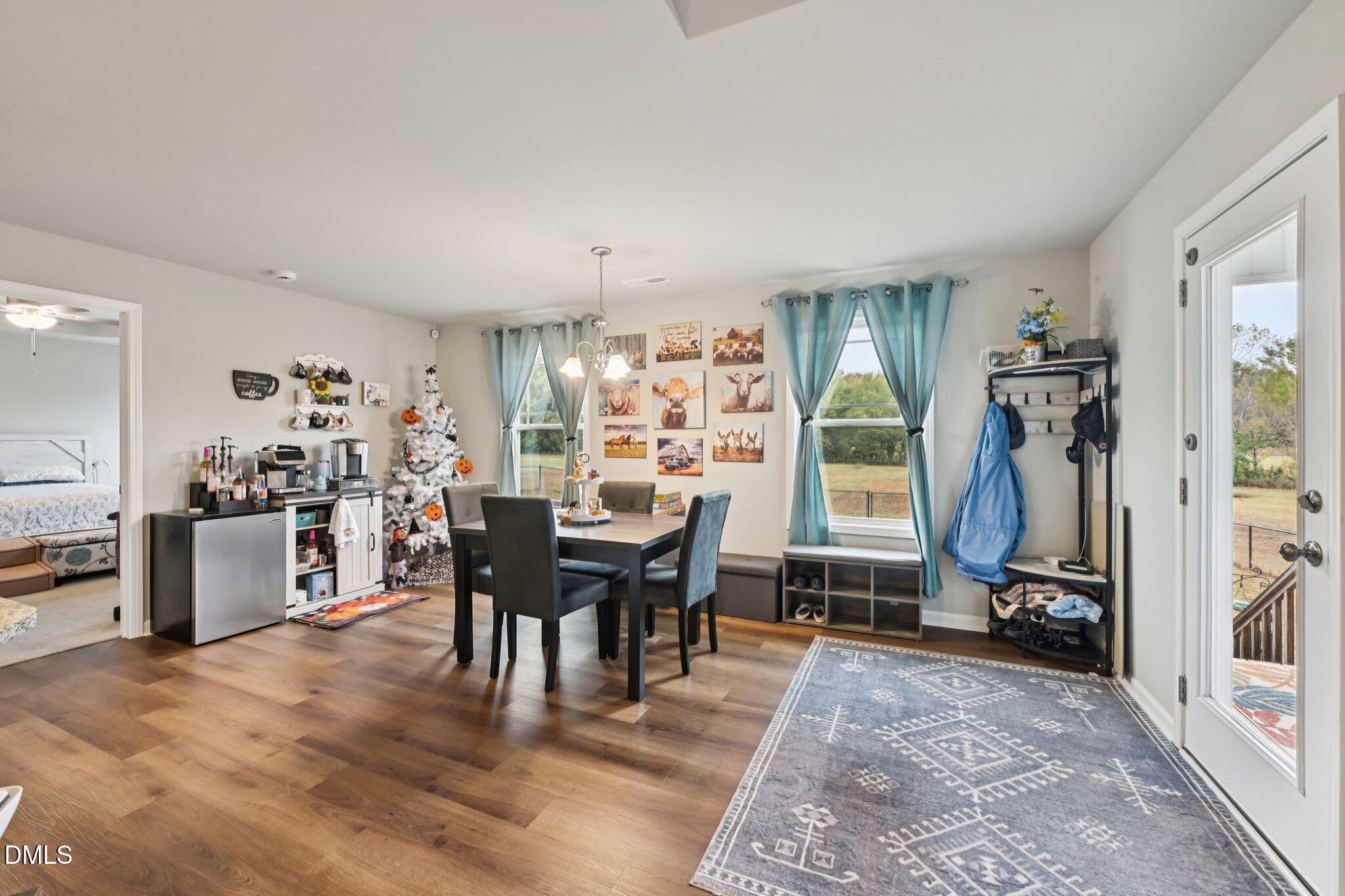 391 Byrdtown Road Benson, NC 27504 - Photo 6 of 28 a view of a dining room with furniture and a window