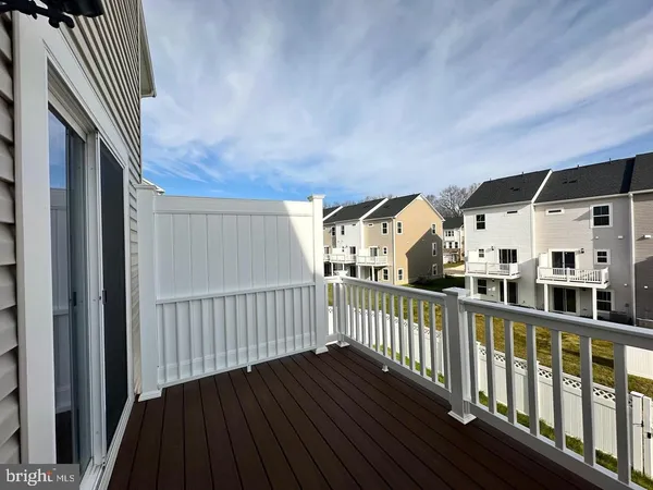 a view of balcony with wooden floor
