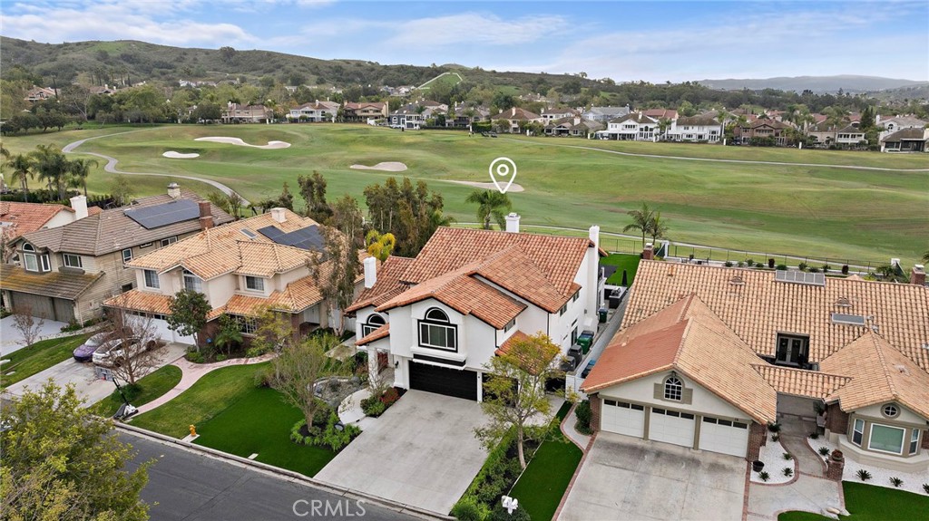 18 Cll De Princesa Coto de Caza, CA 92679 - Photo 1 of 1 an aerial view of a house with a garden and lake view