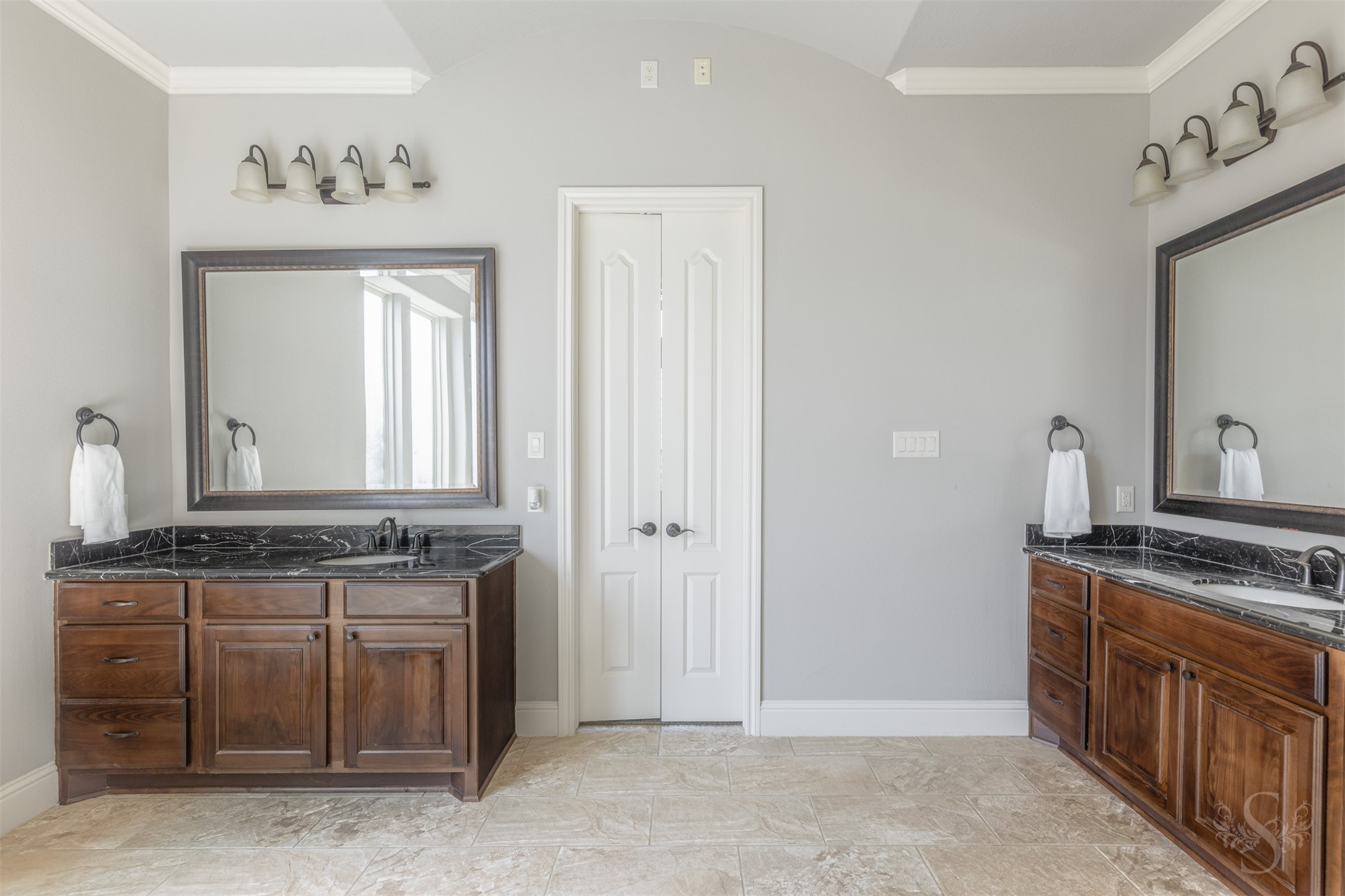 5803 Mustang Ridge Lane Fulshear, TX 77441 - Photo 16 of 48 Dual vanities with rich cabinetry, granite countertops and abundant storage enhance the beautifully designed primary bath. The spacious layout blends comfort and convenience with timeless finishes throughout.