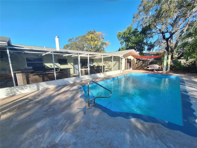 a view of a swimming pool with an outdoor space